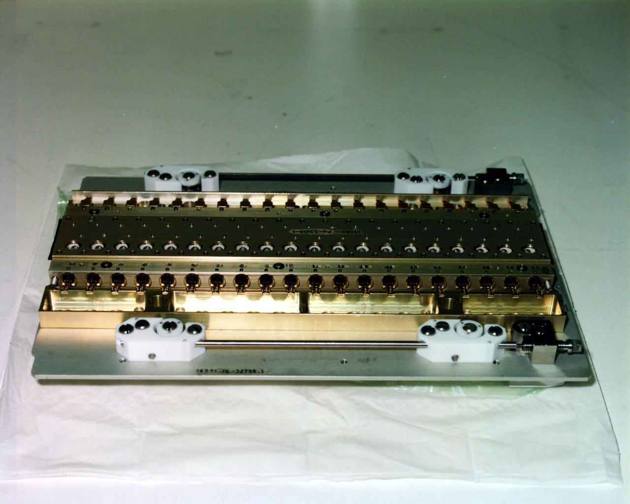 These Vapor Diffusion Apparatus (VDA) trays were first flown in the Thermal Enclosure System (TES) during the USMP-2 (STS-62) mission. Each tray can hold 20 protein crystal growth chambers. Each chamber contains a double-barrel syringe; one barrel holds protein crystal solution and the other holds precipitant agent solution. During the microgravity mission, a torque device is used to simultaneously retract the plugs in all 20 syringes. The two solutions in each chamber are then mixed. After mixing, droplets of the combined solutions are moved onto the syringe tips so vapor diffusion can begin. During the length of the mission, protein crystals are grown in the droplets. Shortly before the Shuttle's return to Earth, the experiment is deactivated by retracting the droplets containing protein crystals, back into the syringes.