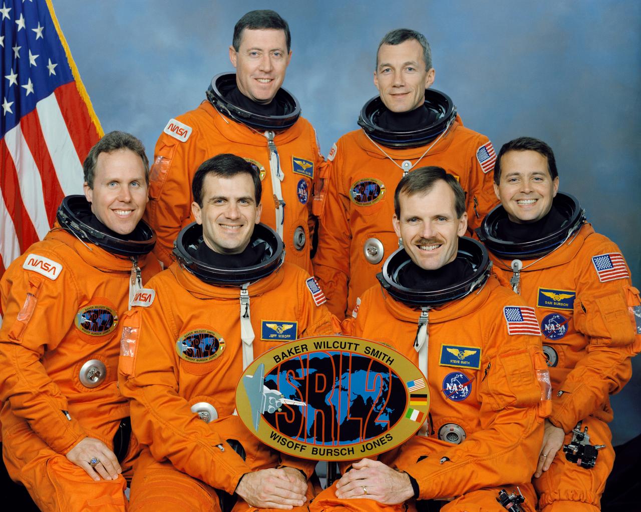 These six NASA astronauts composed the crew of the STS-68 mission that launched aboard the Space Shuttle Endeavour on September 30, 1994. Standing are, left to right, Michael A. Baker, mission commander; and Terrence W. Wilcutt, pilot. On the front row are, left to right, Thomas D. Jones, payload commander; and Peter J. K. (Jeff) Wisoff, Steven L. Smith, and Daniel W. Bursch, all mission specialists. STS-68 marked the second flight of the Space Radar Laboratory, part of NASA’s mission to planet Earth.