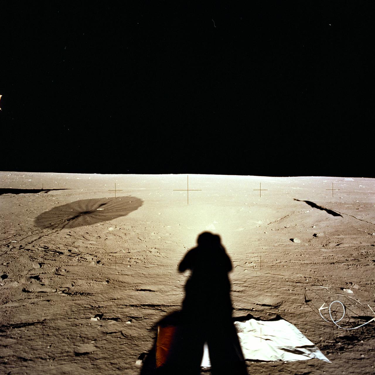 The second manned lunar landing mission, Apollo 12 launched from launch pad 39-A at Kennedy Space Center in Florida on November 14, 1969 via a Saturn V launch vehicle. The Saturn V vehicle was developed by the Marshall Space Flight Center (MSFC) under the direction of Dr. Wernher von Braun. Aboard Apollo 12 was a crew of three astronauts: Alan L. Bean, pilot of the Lunar Module (LM), Intrepid; Richard Gordon, pilot of the Command Module (CM), Yankee Clipper; and Spacecraft Commander Charles Conrad. The LM, Intrepid, landed astronauts Conrad and Bean on the lunar surface in what’s known as the Ocean of Storms while astronaut Richard Gordon piloted the CM, Yankee Clipper, in a parking orbit around the Moon. Lunar soil activities included the deployment of the Apollo Lunar Surface Experiments Package (ALSEP), finding the unmanned Surveyor 3 that landed on the Moon on April 19, 1967, and collecting 75 pounds (34 kilograms) of rock samples. This is the fourth of 25 images captured by the crew in attempt to provide a 360 degree Lunar surface scene. Apollo 12 safely returned to Earth on November 24, 1969.