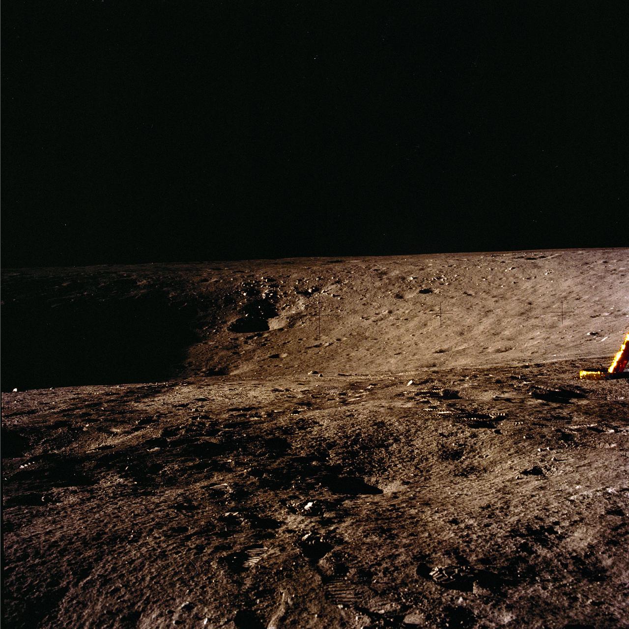 The second manned lunar landing mission, Apollo 12 launched from launch pad 39-A at Kennedy Space Center in Florida on November 14, 1969 via a Saturn V launch vehicle. The Saturn V vehicle was developed by the Marshall Space Flight Center (MSFC) under the direction of Dr. Wernher von Braun. Aboard Apollo 12 was a crew of three astronauts: Alan L. Bean, pilot of the Lunar Module (LM), Intrepid; Richard Gordon, pilot of the Command Module (CM), Yankee Clipper; and Spacecraft Commander Charles Conrad. The LM, Intrepid, landed astronauts Conrad and Bean on the lunar surface in what’s known as the Ocean of Storms while astronaut Richard Gordon piloted the CM, Yankee Clipper, in a parking orbit around the Moon. Lunar soil activities included the deployment of the Apollo Lunar Surface Experiments Package (ALSEP), finding the unmanned Surveyor 3 that landed on the Moon on April 19, 1967, and collecting 75 pounds (34 kilograms) of rock samples. This is the tenth of 25 images captured by the crew in attempt to provide a 360 degree Lunar surface scene. Apollo 12 safely returned to Earth on November 24, 1969.