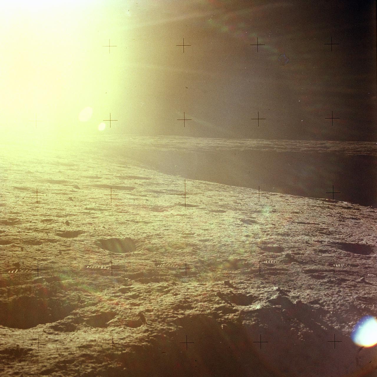 The second manned lunar landing mission, Apollo 12, launched from launch pad 39-A at Kennedy Space Center in Florida on November 14, 1969 via a Saturn V launch vehicle. The Saturn V vehicle was developed by the Marshall Space Flight Center (MSFC) under the direction of Dr. Wernher von Braun. Aboard Apollo 12 was a crew of three astronauts: Alan L. Bean, pilot of the Lunar Module (LM), Intrepid; Richard Gordon, pilot of the Command Module (CM), Yankee Clipper; and Spacecraft Commander Charles Conrad. The LM, Intrepid, landed astronauts Conrad and Bean on the lunar surface in what’s known as the Ocean of Storms while astronaut Richard Gordon piloted the CM, Yankee Clipper, in a parking orbit around the Moon. Lunar soil activities included the deployment of the Apollo Lunar Surface Experiments Package (ALSEP), finding the unmanned Surveyor 3 that landed on the Moon on April 19, 1967, and collecting 75 pounds (34 kilograms) of rock samples. This is the fourteenth of 25 images captured by the crew in attempt to provide a 360 degree Lunar surface scene. Apollo 12 safely returned to Earth on November 24, 1969.