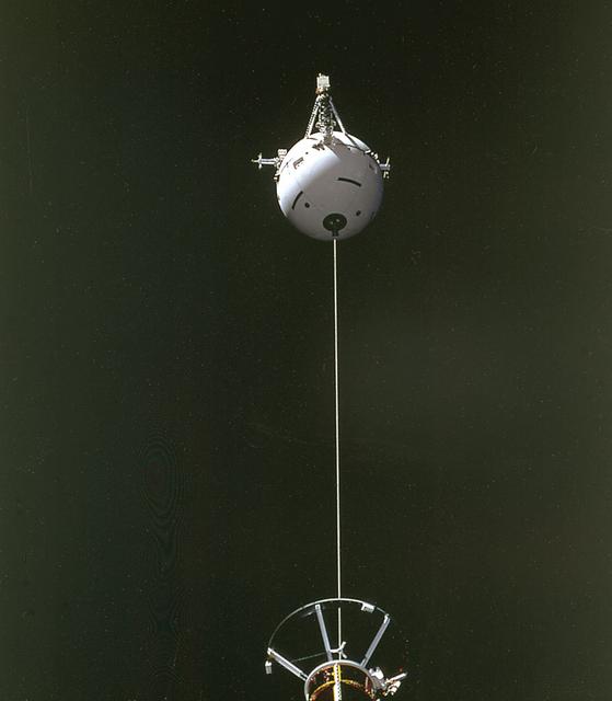This is a Space Shuttle Orbiter Atlantis (STS-46) onboard photo of the Tethered Satellite System (TSS-1) deployment. A cooperative development effort by the Italian Space Agency (ASI) and NASA, the Tethered Satellite System (TSS) made capable the deployment and retrieval of a satellite which is attached by a wire tether from distances up to 100 km from the Orbiter. These free-flying satellites are used as observation platforms outside of the Orbiter.