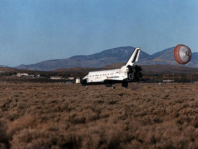 The drag-chute is fully deployed as the Space Shuttle Atlantis (STS-66) heads toward a stop at Edwards Air Force Base in southern California, ending a successful mission. The crew supported the Atmospheric Laboratory for Applications and Science (ATLAS-3), conducting approximately 80 experiments. The Cryogenic Infrared Spectrometer and Telescopes for the Atmosphere-Shuttle Pallet Satellite (CRISTA-SPAS), which was developed by German engineers, was successfully deployed and retrieved during this space mission.
