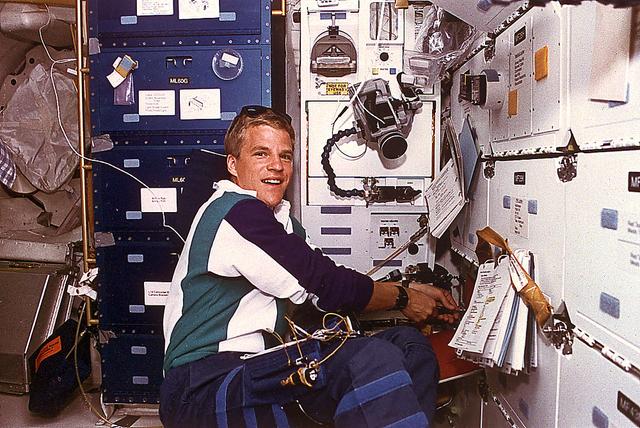 This is an onboard photo of space shuttle Atlantis (STS-66) astronaut Scott E. Parazynski, in the International Microgravity Laboratory (IML), performing a series of experiments devoted to material and life sciences studies using the Spacelab Long Module (SLM). STS-066 was launched on November 3, 1994.