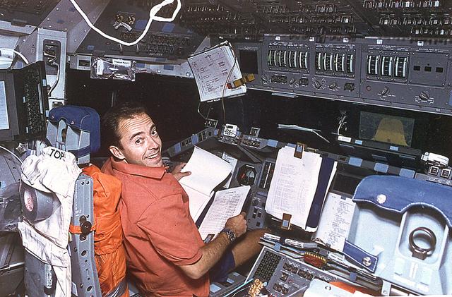 This is an onboard photo of space shuttle Atlantis (STS-66) crew member, French scientist Jean-Francois Clervoy working on the Atmospheric Laboratory for Applied Sciences (ATLAS-3) project. The ATLAS-3 measures the variances of the sun's solar radiation and the variability in the solar spectrum.
