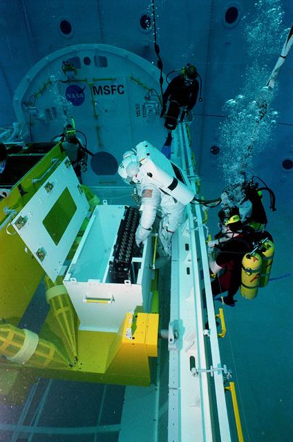 Astronaut Jeff Hoffman conducts Hubble Space Telescope training in Marshall's Neutral Buoyancy Simulator (NBS)