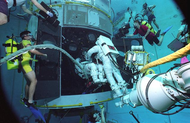 Astronauts Greg Harbaugh and Steve Smith conduct Hubble Space Telescope (HST) training in Marshall's Neutral Buoyancy Simulator (NBS).