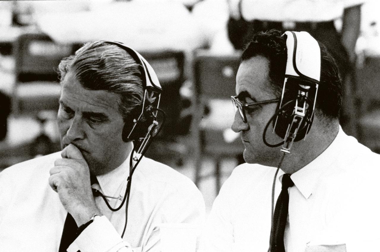 Marshall Space Flight Center (MSFC) Director Dr. Wernher von Braun (left) with Kennedy Space Center (KSC) Rocco Petrone prior to the January 29, 1964 launch of SA-5, the first Block II configuration of the Saturn I launch vehicle. Petrone played key roles at KSC in the development of Saturn launch facilities before becoming director of launch operations in 1966.