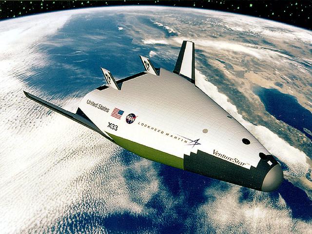 In this artist's concept, the X-33 Venture Star, a Reusable Launch Vehicle (RLV), manufactured by Lockheed Martin Skunk Works, is shown in orbit with a deployed payload. The Venture Star was one of the earliest versions of the RLV's developed to replace the aging shuttle fleet. The X-33 program was cancelled in 2001.