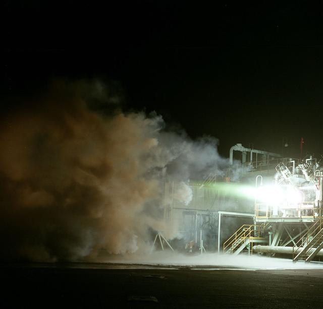 750 K motor test firing at Marshall's Test Stand 116 developing 650 pounds of thrust. The motor was tested for the Air Force Expendable Launch Vehicle (ELV) project.