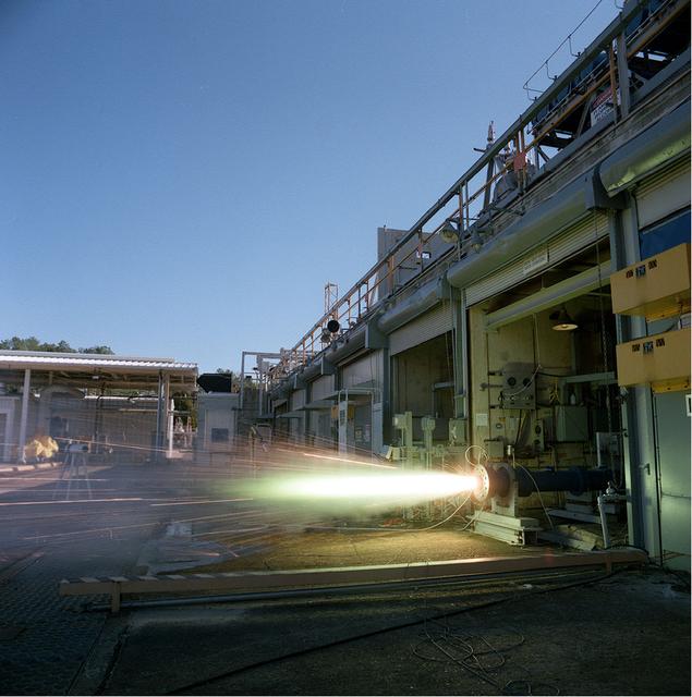 An eleven inch (11) hybrid motor gaseous oxygen (GOX) fuel firing at Marshall's test cell 103.