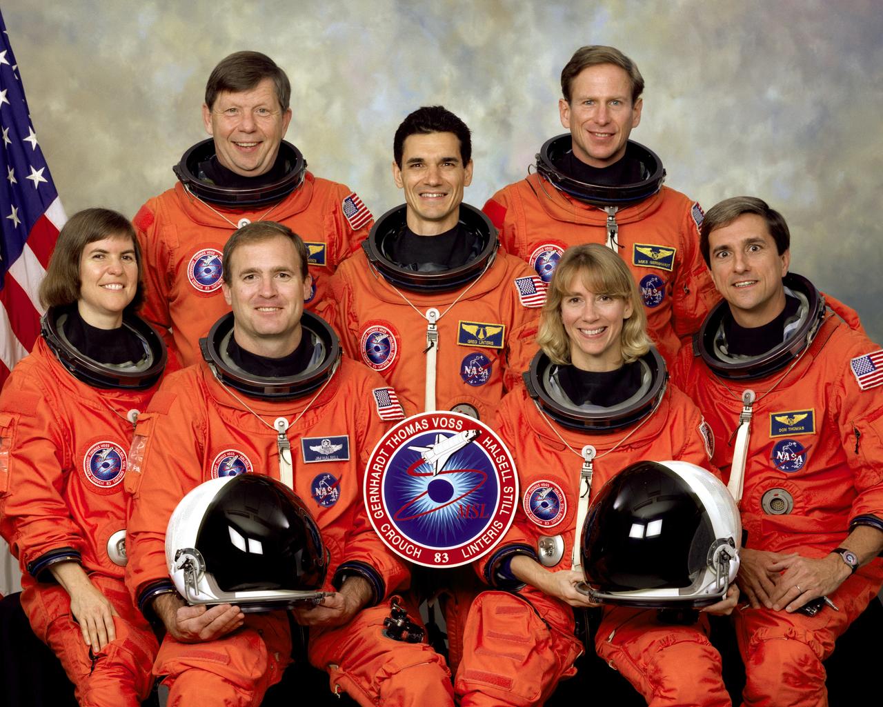 Five NASA astronauts and two scientists comprised the crew for the STS-83 mission in support of the first Microgravity Sciences Laboratory 1 (MSL-1). Pictured on the front row (left to right) are Janice E. Voss, payload commander; James D. Halsell, commander; Susan L. Still, pilot; and Donald A. Thomas, mission specialist.  On the back row (left to right) are payload specialists Roger K. Crouch, and Gregory T. Linteris; and Michael L. Gernhardt, mission  specialist. Dr. Crouch and Dr. Linteris are experts in several disciplines treated on MSL-1. STS-83 launched aboard the Space Shuttle Columbia on April 4, 1997. The five launched again in July 1997 for the STS-94 mission.