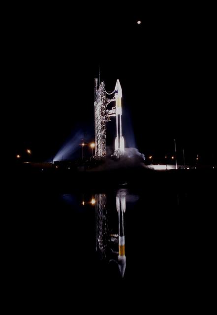 The reflection of the Atlas IIAS expendable launch vehicle with the Solar Heliospheric Observatory (SOHO) inside its payload fairing can be seen on the surface of a retention pond at Launch Pad 36B on Cape Canaveral Air Station just hours before liftoff. SOHO is a cooperative effort involving NASA and the European Space Agency (ESA) within the framework of the International Solar-Terrestrial Physics Program. During its 2-year mission, the SOHO spacecraft will gather data on the internal structure of the Sun, its extensive outer atmosphere and the origin of the solar wind.