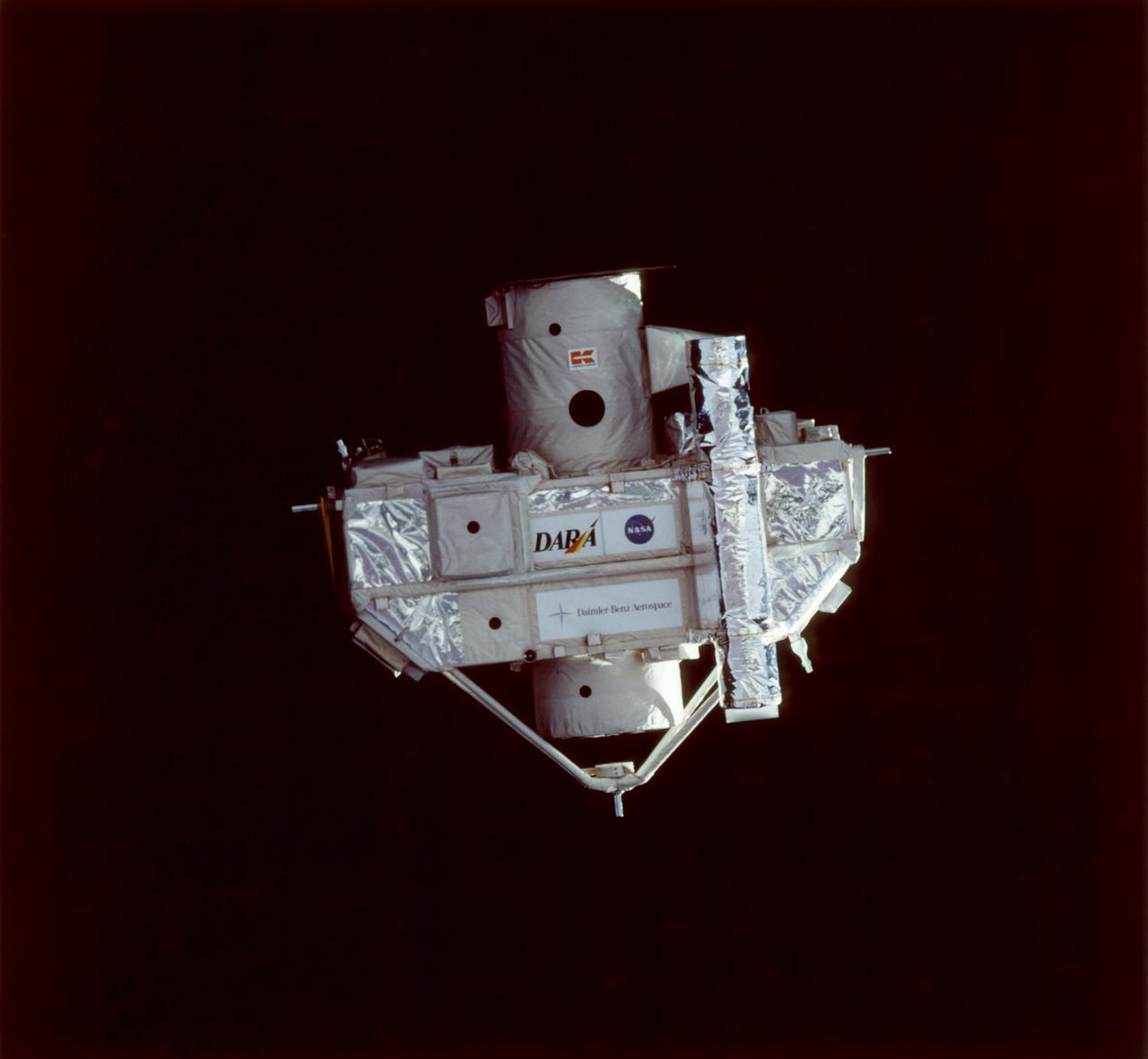 This STS-80 onboard photograph shows the Orbiting Retrievable Far and Extreme Ultraviolet Spectrometer-Shuttle Pallet Satellite II (ORFEUS-SPAS II), photographed during approach by the Space Shuttle Orbiter Columbia for retrieval. Built by the German Space Agency, DARA, the ORFEUS-SPAS II, a free-flying satellite, was dedicated to astronomical observations at very short wavelengths to: investigate the nature of hot stellar atmospheres, investigate the cooling mechanisms of white dwarf stars, determine the nature of accretion disks around collapsed stars, investigate supernova remnants, and investigate the interstellar medium and potential star-forming regions. Some 422 observations of almost 150 astronomical objects were completed, including the Moon, nearby stars, distant Milky Way stars, stars in other galaxies, active galaxies, and quasar 3C273. The STS-80 mission was launched November 19, 1996.