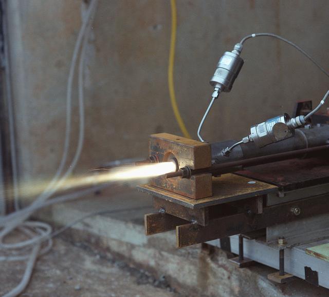 Fuels used in the 11 inch and 24 inch lab-scale hybrid motors are ignited at Marshall's test cell 104.