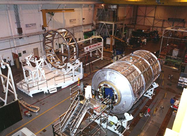 Photograph shows the International Space Station Laboratory Module under fabrication at Marshall Space Flight Center (MSFC), Building 4708 West High Bay. Although management of the U.S. elements for the Station were consolidated in 1994, module and node development continued at MSFC by Boeing Company, the prime contractor for the Space Station. 