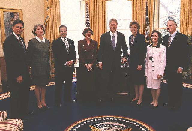 Marshall's eighth Center Director Dr. Jerroll W. Littles (1996-1998) and his wife are pictured with President Bill Clinton in the Oval Office of the White House following the presentation of the Presidential Rank Award for Distinguished Service. Other NASA honorees and their spouses are also pictured.