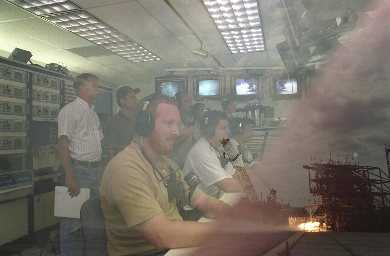 This double exposure depicts Marshall Space Flight Center's (MSFC) Test Stand 116 hosting a 60K Bantam Fastrac thrust chamber assembly test. The lower right exposure shows the engine firing in the test stand while the center exposure reveals workers monitoring the test in the interior block house of the test facility. The thrust chamber assembly is only part of the Fastrac engine project to build a low-cost engine for the X-34, an alternate light-weight unmarned launch vehicle. Both the nozzle and the engine for Fastrac are being manufactured at MSFC.