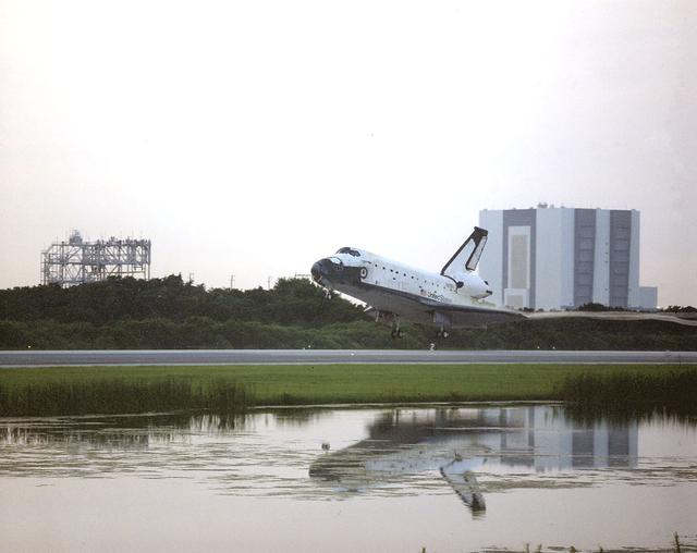 Framed by the Vehicle Assembly Building at right and the Mate-Demate Device at left, the Space Shuttle orbiter Columbia (STS-94) glided onto Runway 33 of Kennedy Space Center's Shuttle Landing Facility. On board for the reflight of STS-83 were a crew of seven and the Microgravity Science Laboratory-1 (MSL-1)which was managed by scientists and engineers from the Marshall Space Flight Center. Mission STS-94 marked the 23rd flight of Columbia and the 85th mission flown since the start of the Space Shuttle program in 1981. During the mission, the Spacelab module was used to test some of the hardware, facilities and procedures that are planned for use on the International Space Station while the flight crew conducted combustion, protein crystal growth and materials processing experiments.