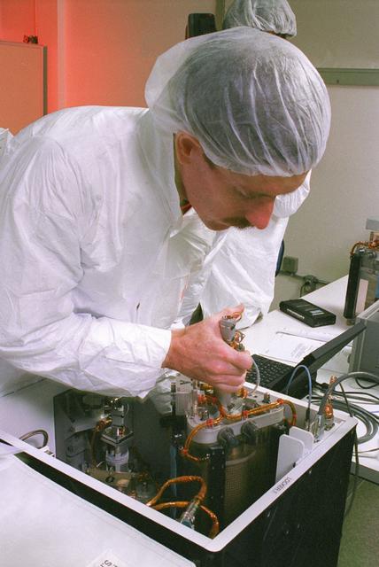 Astronauts Jim Reilly and Bornie Dunbar are going through the Mechanics of Granular Materials (MGM) experiment procedures as they are expected to run in flight; to gain experience with the experiment equipment and to test the clarity and language of the procedures as written.