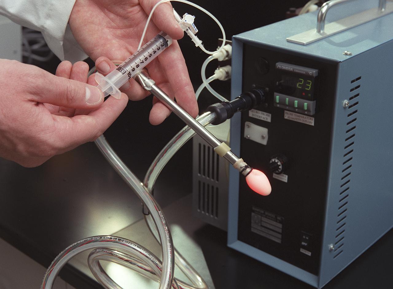 A special lighting technology was developed for space-based commercial plant growth research on NASA's Space Shuttle. Surgeons have used this technology to treat brain cancer on Earth, in two successful operations. The treatment technique called photodynamic therapy, requires the surgeon to use tiny pinhead-size Light Emitting Diodes (LEDs) (a source releasing long wavelengths of light) to activate light-sensitive, tumor-treating drugs. Laser light has been used for this type of surgery in the past, but the LED light illuminates through all nearby tissues, reaching parts of a tumor that shorter wavelengths of laser light carnot. The new probe is safer because the longer wavelengths of light are cooler than the shorter wavelengths of laser light, making the LED less likely to injure normal brain tissue near the tumor. It can also be used for hours at a time while still remaining cool to the touch. The LED probe consists of 144 tiny pinhead-size diodes, is 9-inches long, and about one-half-inch in diameter. The small balloon aids in even distribution of the light source. The LED light source is compact, about the size of a briefcase, and can be purchased for a fraction of the cost of a laser. The probe was developed for photodynamic cancer therapy by the Marshall Space Flight Center under a NASA Small Business Innovative Research program grant.