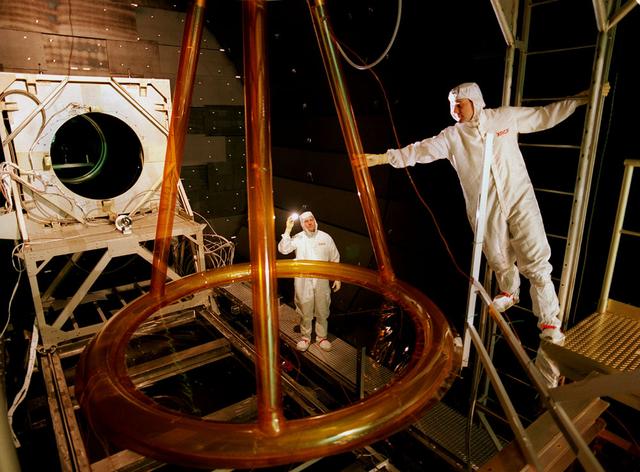 The Shooting Star Experiment (SSE) is designed to develop and demonstrate the technology required to focus the sun's energy and use the energy for inexpensive space Propulsion Research. Pictured is an engineering model (Pathfinder III) of the Shooting Star Experiment (SSE). This model was used to test and characterize the motion and deformation of the structure caused by thermal effects. In this photograph, alignment targets are being placed on the engineering model so that a theodolite (alignment telescope) could be used to accurately measure the deformation and deflections of the engineering model under extreme conditions, such as the coldness of deep space and the hotness of the sun as well as vacuum. This thermal vacuum test was performed at the X-Ray Calibration Facility because of the size of the test article and the capabilities of the facility to simulate in-orbit conditions