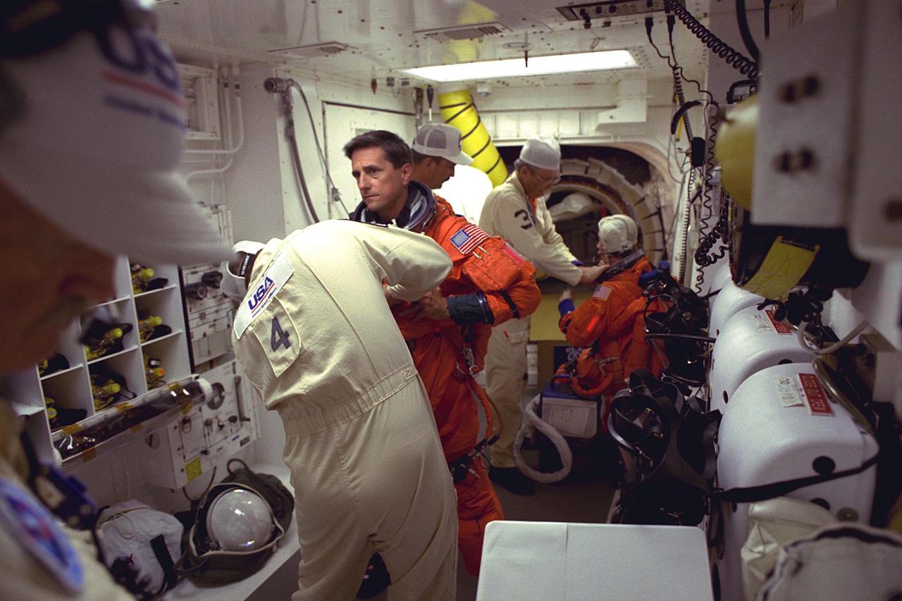 STS-94 Mission Specialist Donald A. Thomas prepares to enter the Space Shuttle Columbia at Launch Pad 39A in preparation for launch.  He has flown on STS-83, STS-70 and STS-65. He holds a  doctorate in materials science and has been the Principal Investigator for a Space Shuttle  crystal growth experiment. Because of his background in materials science, Thomas will  be concentrating his efforts during the Red shift on the five experiments in this discipline  in the Large Isothermal Furnace. He also will work on  the ten materials science  investigations in the Electromagnetic Containerless Processing Facility and four that will  be measuring the effects of  microgravity and motion in the orbiter on the experiments.  Thomas and six fellow crew members will lift off during a launch window that  opens at 1:50 p.m. EDT, July 1. The launch window will open 47 minutes early to  improve the opportunity to lift off before Florida summer rain showers reach the space  center