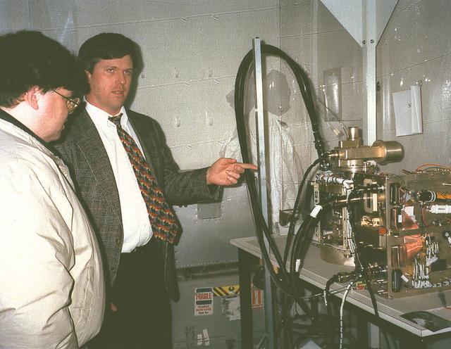Joel Kearns viewing a laboratory demonstration of the Observable Protein Crystal Growth Apparatus (OPCGA) experiment module. Principal Investigator is Alexander McPherson. First flight plarned for ISS.