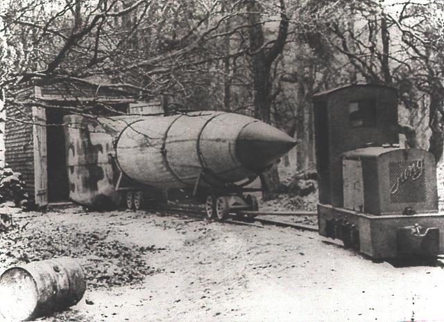 In this undated file photo, probably from World War II, a V-2 rocket emerges from its camouflaged shelter. The team of German engineers and scientists who developed the V-2 came to the United States after World War II and worked for the U. S. Army at Fort Bliss, Texas and Redstone Arsenal in Huntsville, Alabama.