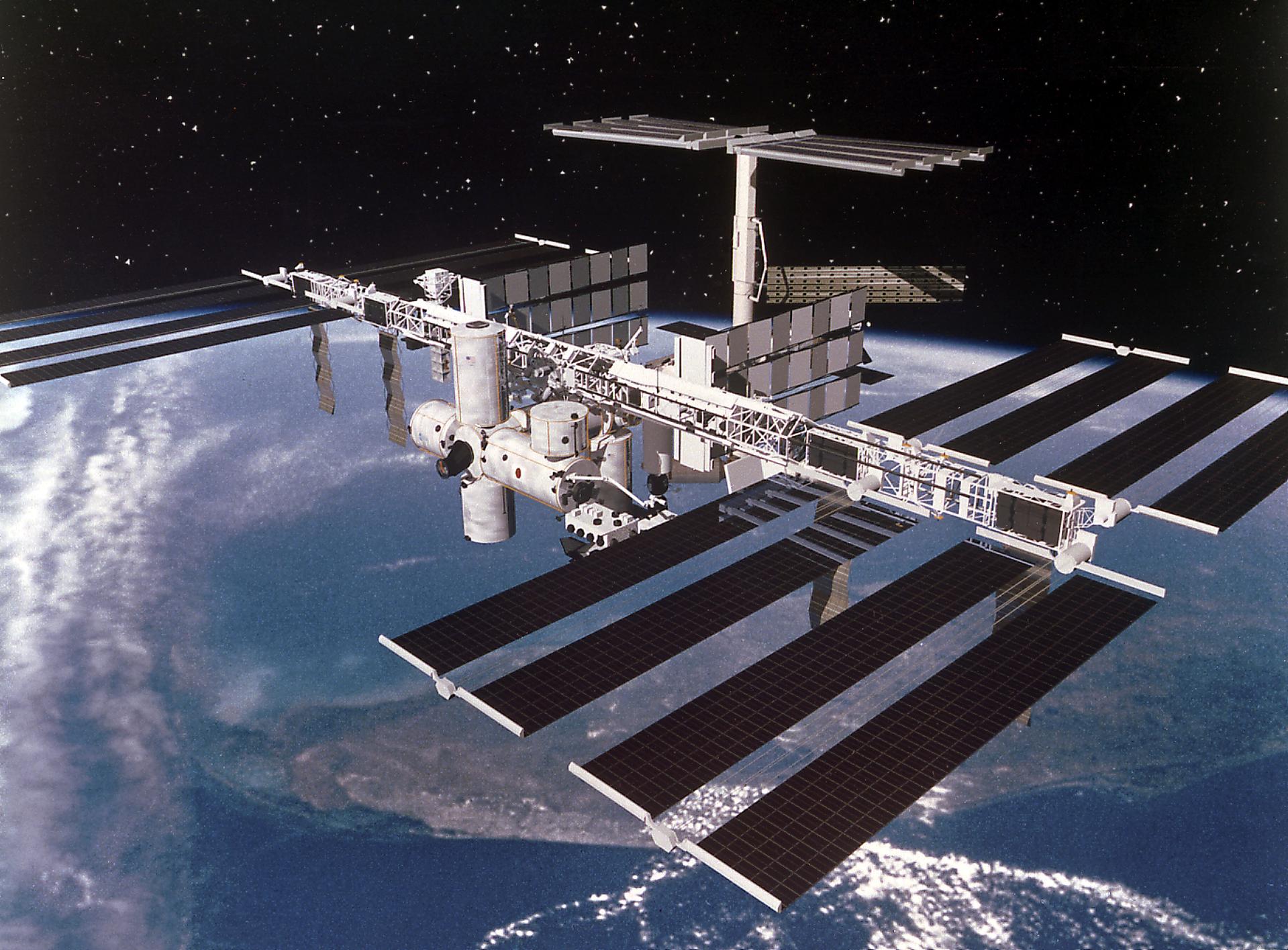 Artist's digital concept depicting the completely assembled International Space Station (ISS) passing over Florida.
