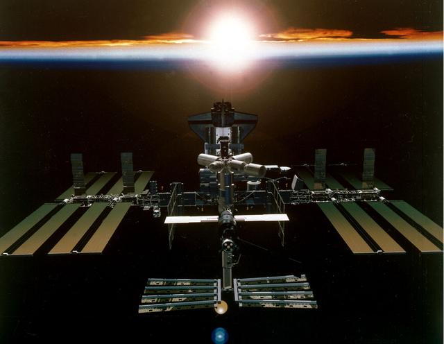 Artist's digital concept of the International Space Station (ISS), a gateway to permanent human presence in space, after all assembly is completed in Year 2003. The Station will be powered by almost an acre of solar panels and have a mass of almost one million pounds. Station modules are being provided by the United States, Russia, Japan, and Europe. Canada is providing a mechanical arm and Canada Hand. Sixteen countries are cooperating to provide a multidisciplinary laboratory, technology test bed, and observatory that will provide an unprecedented undertaking in scientific, technological, and international experimentation. 