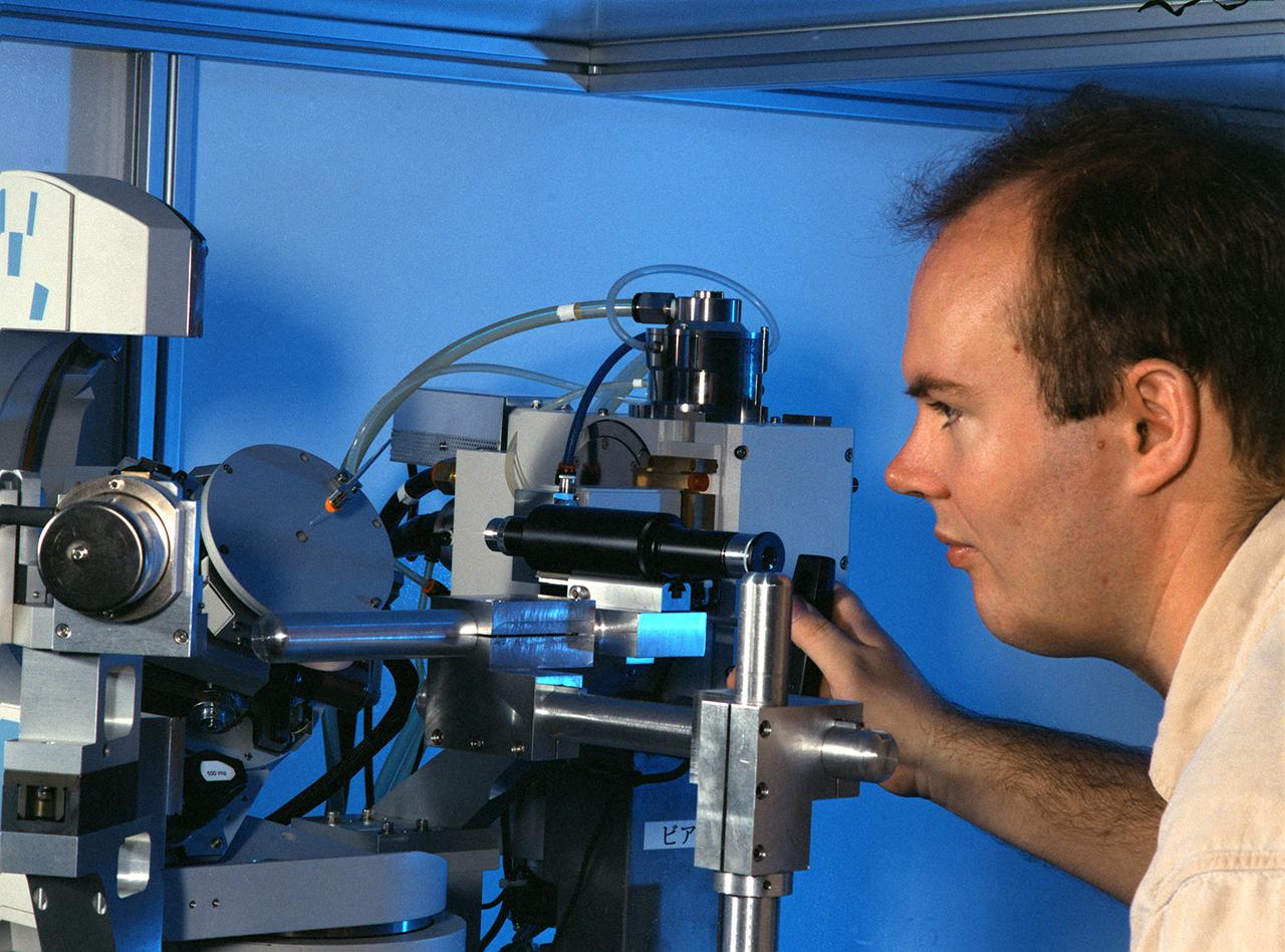 Eddie Snell, Post-Doctoral Fellow the National Research Council (NRC) uses a reciprocal space mapping diffractometer for macromolecular crystal quality studies. The diffractometer is used in mapping the structure of macromolecules such as proteins to determine their structure and thus understand how they function with other proteins in the body. This is one of several analytical tools used on proteins crystallized on Earth and in space experiments. Photo credit: NASA/Marshall Space Flight Center (MSFC)