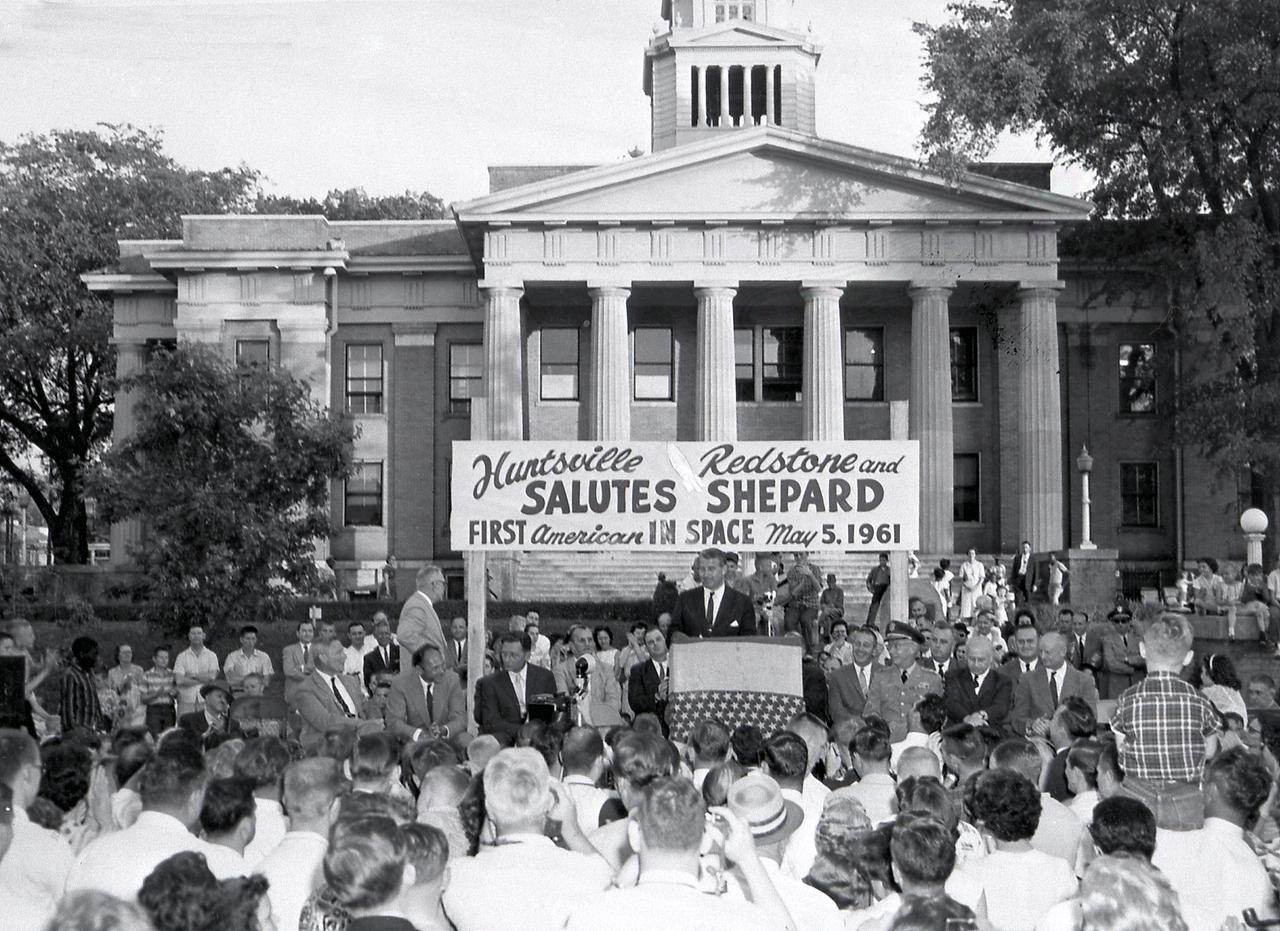 Dr. von Braun addresses a crowd celebrating in front of the Madison County Alabama Courthouse following the successful launch of Astronaut Alan Shepard (America's first astronaut in space) into space on a Mercury-Redstone Launch Vehicle, Freedom 7. Shepard's Mercury Spacecraft, was launched from Cape Canaveral. He reached a speed of 5200 mph. His flight lasted 15-1/2 minutes. May 5, 1961 (Photo: Courtesy of Huntsville/Madison County Public Library)