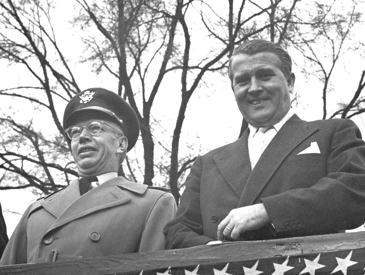 This photograph was taken about 1960 and shows Dr. von Braun viewing a parade with Major General John Barclay.