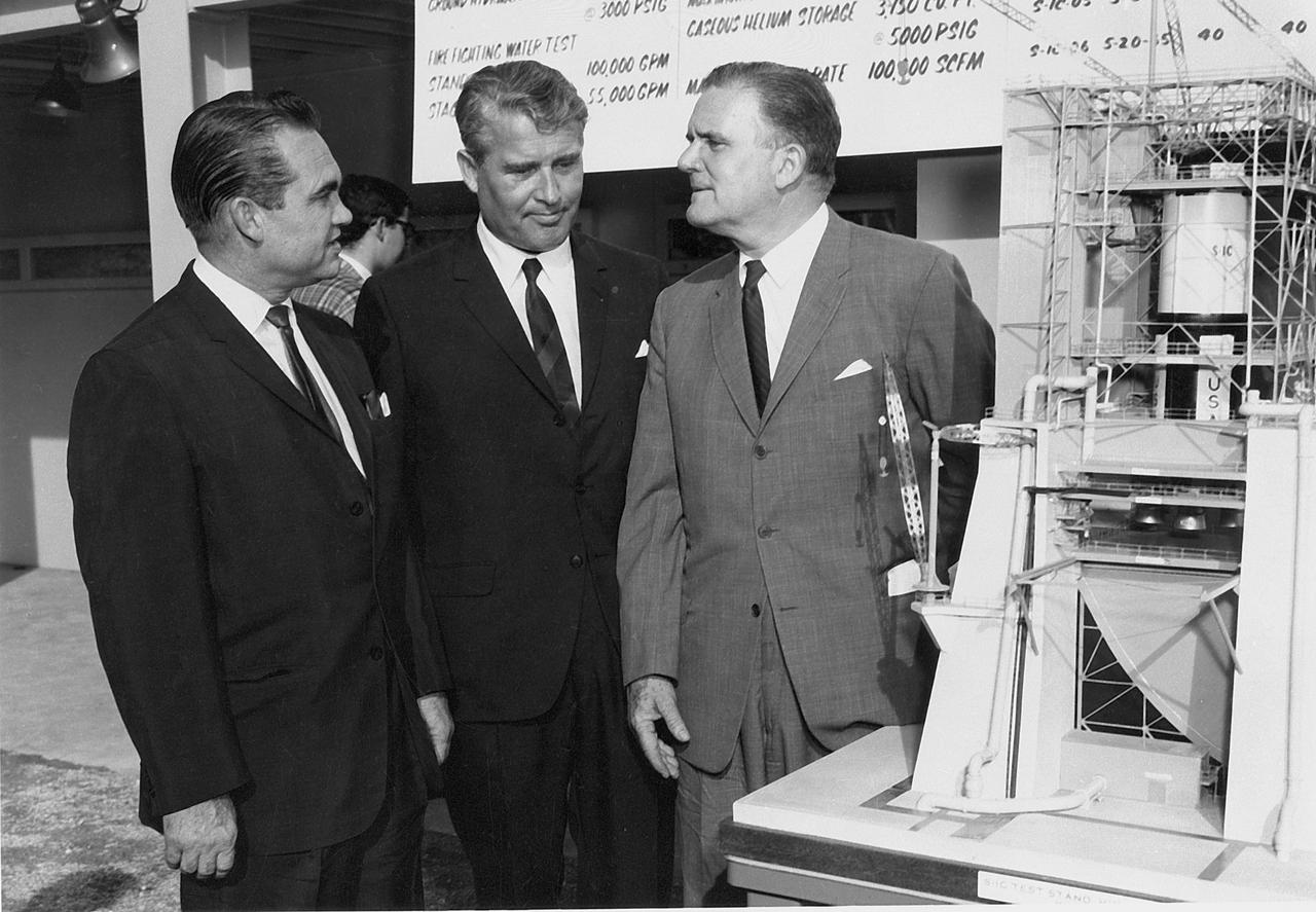 In this photograph are Alabama Governor George Wallace (left), Marshall Space Flight Center Dr. Wernher von Braun (Center) and NASA Administrator James Webb (right). Governor Wallace and Dr. Webb were at MSFC to witness the first test firing of a Saturn V Booster, along with members of the Alabama legislature and press reporters. 
