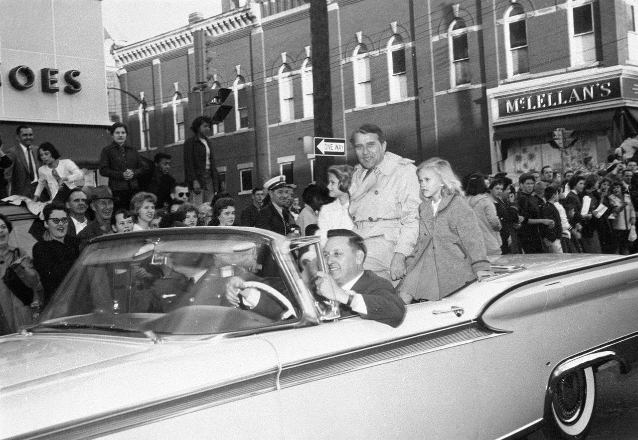 Dr. Wernher von Braun, Director of the U.S. Army Ballistic Missile Agency's (ABMA) Development Operations Division, rides with his two daughters, Margrit and Iris, in a parade in downtown Huntsville, Alabama, March 4, 1959. Although the official occasion had been plarned a "Moon Day" weeks before, it was the successful launch of the sun probe Pioneer IV two days previously that increased the celebratory atmosphere. 