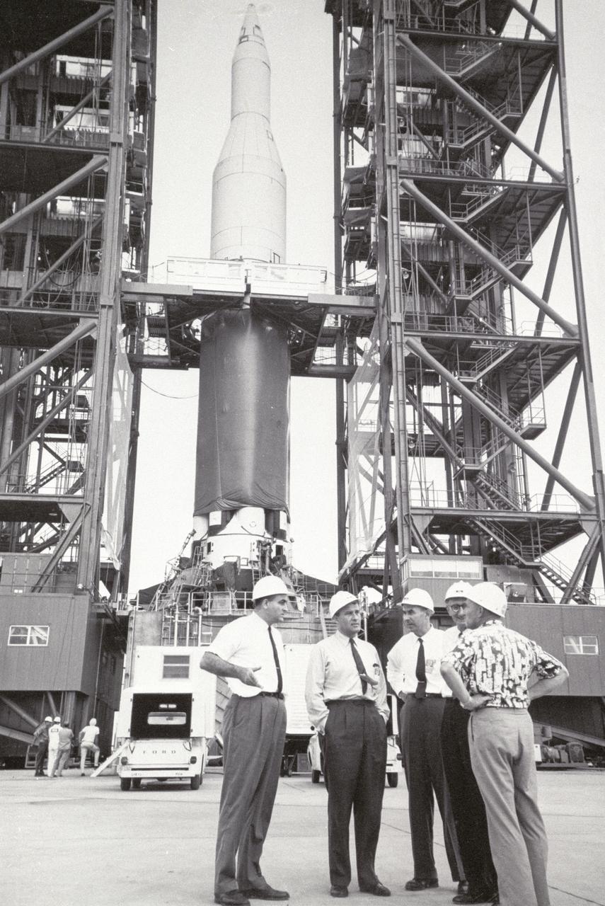 Pictured in front of the Saturn 1 launch vehicle are (L to R): Dr. Rocco Petrone, Director of Launch Operations at Kennedy Space Center; Dr. Werher von Braun, Director of Marshall Space Flight Center; Dr. Oswald Lange, Director of the Saturn Systems Office; Mr. Hans. H. Maus, Director of Fabrication and Assembly Engineering Division; and Dr. Hans Gruene, Deputy Director of Launch Operations Directorate. Maus and Gruene were original members of von Braun's rocket team.