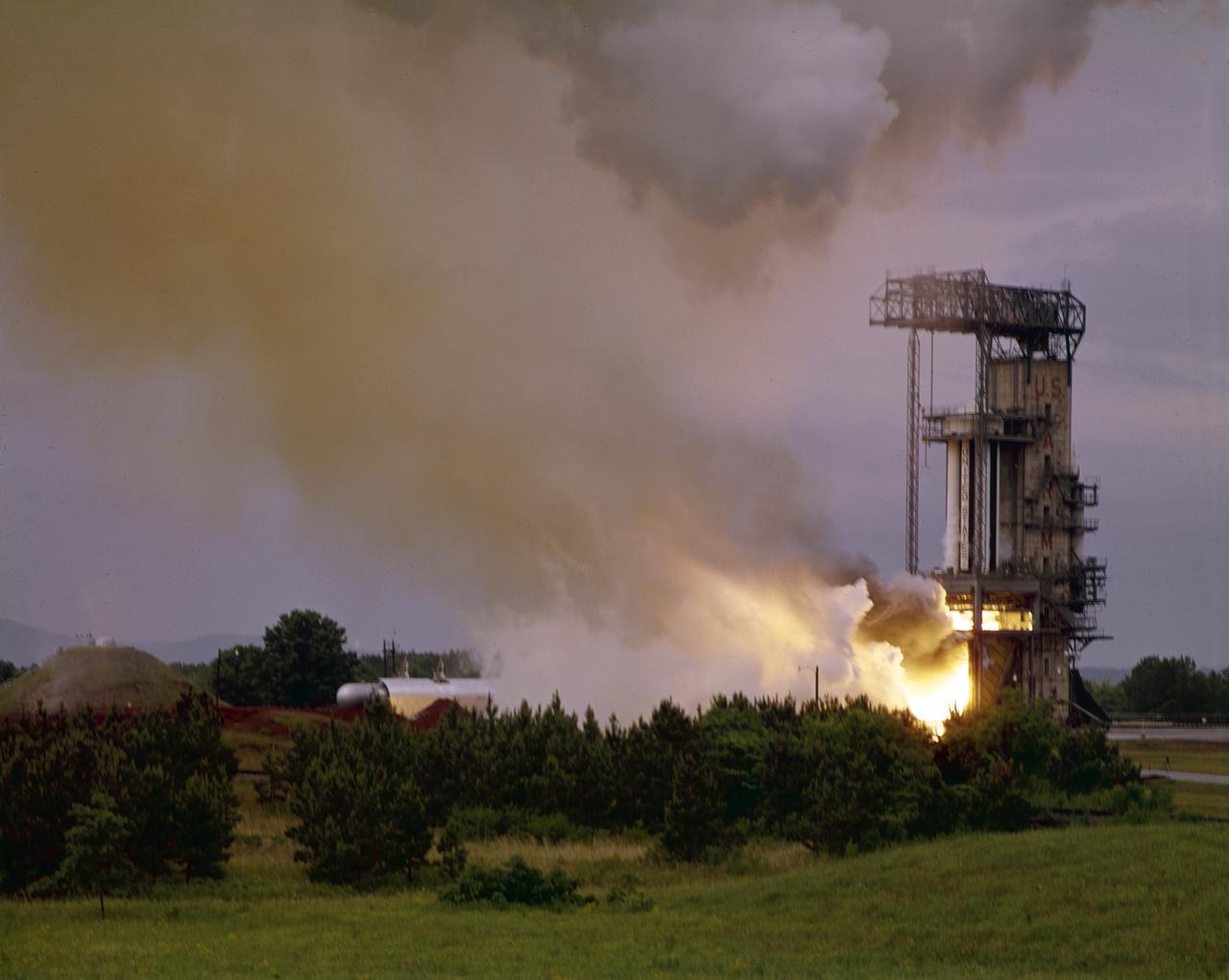 Pictured is one of the earliest testing of the Saturn I S-I (first) stage, with a cluster of eight H-1 engines, at the Marshall Space Flight Center (MSFC). It was a part of the test program to prove out the clustered-booster concept. MSFC was responsible for designing and development the Saturn launch vehicles.
