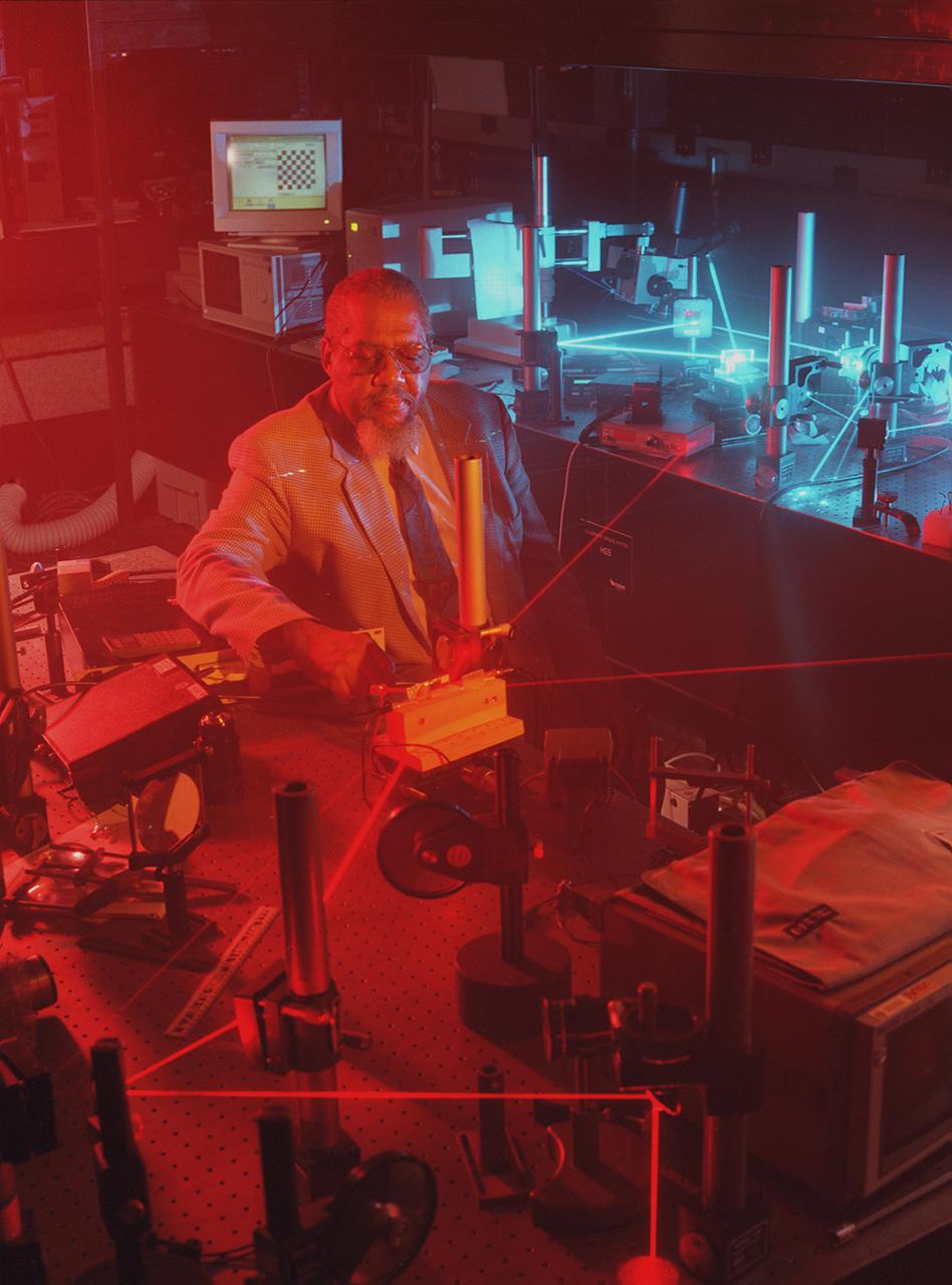 Dr. Donald Frazier works with a laser imaging system designed by Dr. Hossin Abdeldayem for pattern recognition applications. Photo credit: NASA/Marshall Space Flight Center (MSFC)