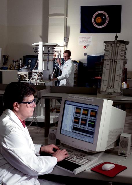 Advanced Automated Directional Solidification Furnace (AADSF) G-Cel with Fred Flack and Wayne Gandy in the Microgravity Development Laboratory clean room.