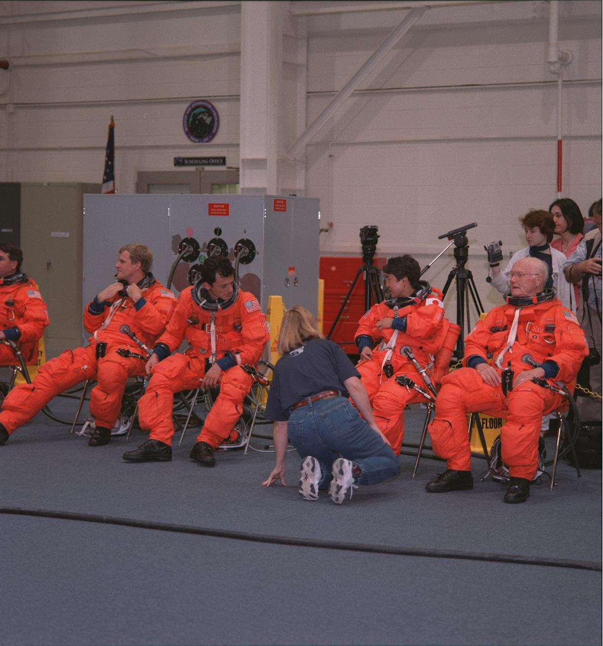 S98-07973 (5 June 1998) --- Five of the seven STS-95 crew members are seen as they wait for a training and photo session to begin in the systems integration facility at NASA's Johnson Space Center. From the left are astronauts Stephen K. Robinson (partially out of frame), Scott E. Parazynski and Pedro Duque, all mission specialists; along with Chiaki Mukai and U.S. Sen. John H. Glenn Jr. (D.-Ohio), both payload specialists. Duque represents the European Space Agency and Mukai, Japan's National Space Development Agency (NASDA).