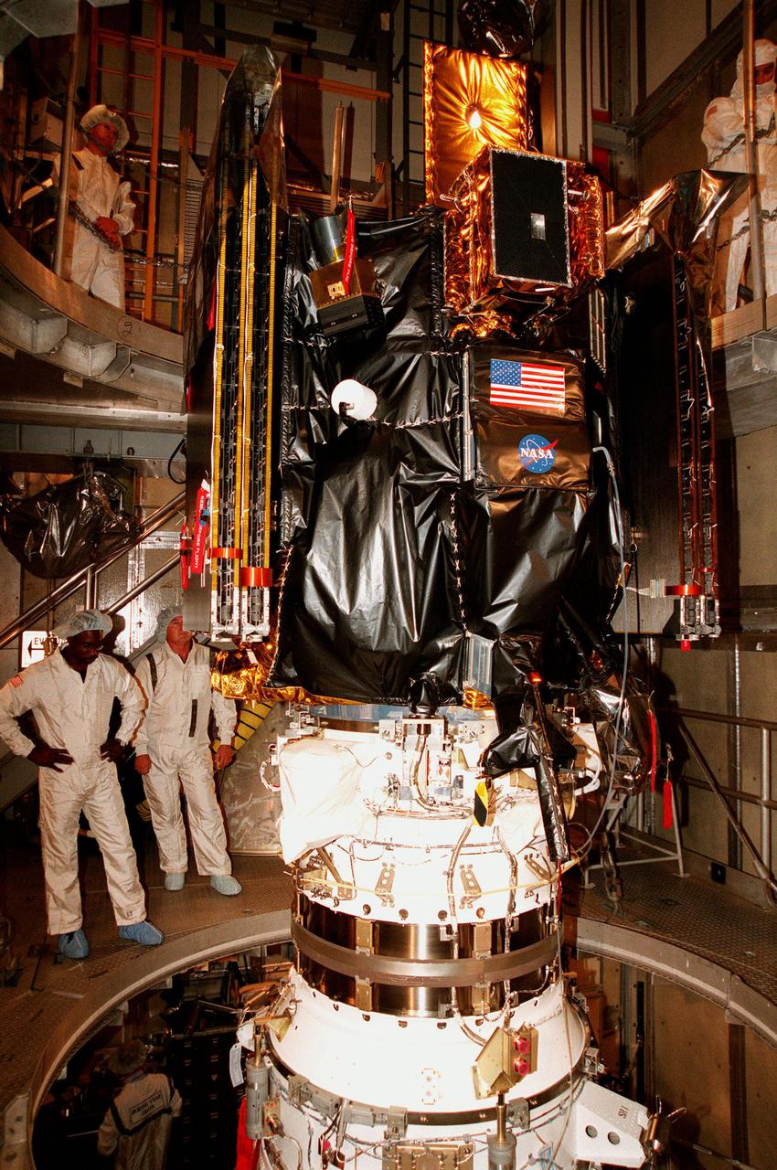 KENNEDY SPACE CENTER, FLA. -- On Launch Pad 17A at Cape Canaveral Air Station, Deep Space 1 awaits launch after installation on a Boeing Delta 7326 rocket. Targeted for launch on Oct. 25, Deep Space 1 is the first flight in NASA's New Millennium Program, and is designed to validate 12 new technologies for scientific space missions of the next century, including the engine. Propelled by the gas xenon, the engine is being flight-tested for future deep space and Earth-orbiting missions. Deceptively powerful, the ion drive emits only an eerie blue glow as ionized atoms of xenon are pushed out of the engine. While slow to pick up speed, over the long haul it can deliver 10 times as much thrust per pound of fuel as liquid or solid fuel rockets. Other onboard experiments include software that tracks celestial bodies so the spacecraft can make its own navigation decisions without the intervention of ground controllers. Deep Space 1 will complete most of its mission objectives within the first two months, but will also do a flyby of a near-Earth asteroid, 1992 KD, in July 1999