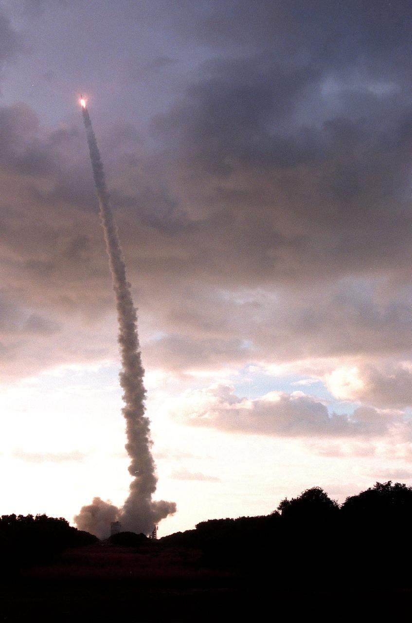 KENNEDY SPACE CENTER, FLA. -- Looking like a comet with a tail of smoky exhaust, Boeing's Delta II rocket hurtles into space carrying NASA's Deep Space 1 spacecraft. The first flight in NASA's New Millennium Program, Deep Space 1 is designed to validate 12 new technologies for scientific space missions of the next century, including the ion propulsion engine. Propelled by the gas xenon, the engine is being flight-tested for future deep space and Earth-orbiting missions. Other onboard experiments include software that tracks celestial bodies so the spacecraft can make its own navigation decisions without the intervention of ground controllers. Deep Space 1 will complete most of its mission objectives within the first two months, but will also do a flyby of a near-Earth asteroid, 1992 KD, in July 1999
