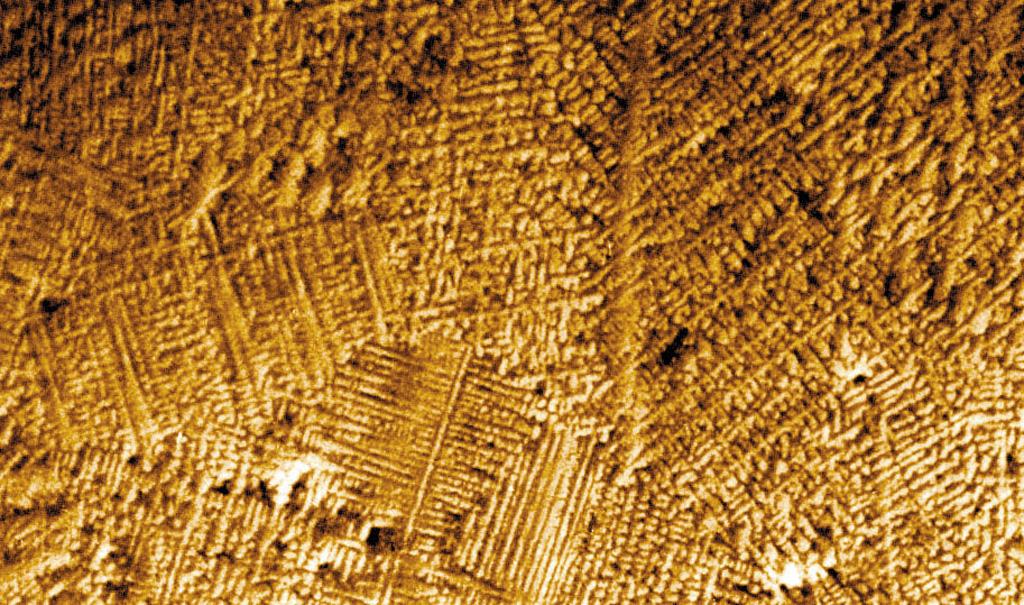 Researchers have found that as melted metals and alloys (combinations of metals) solidify, they can form with different arrangements of atoms, called microstructures. These microstructures depend on the shape of the interface (boundary) between the melted metal and the solid crystal it is forming. There are generally three shapes that the interface can take: planar, or flat; cellular, which looks like the cells of a beehive; and dendritic, which resembles tiny fir trees. Convection at this interface can affect the interface shape and hide the other phenomena (physical events). To reduce the effects of convection, researchers conduct experiments that examine and control conditions at the interface in microgravity. Microgravity also helps in the study of alloys composed of two metals that do not mix. On Earth, the liquid mixtures of these alloys settle into different layers due to gravity. In microgravity, the liquid metals do not settle, and a solid more uniform mixture of both metals can be formed.