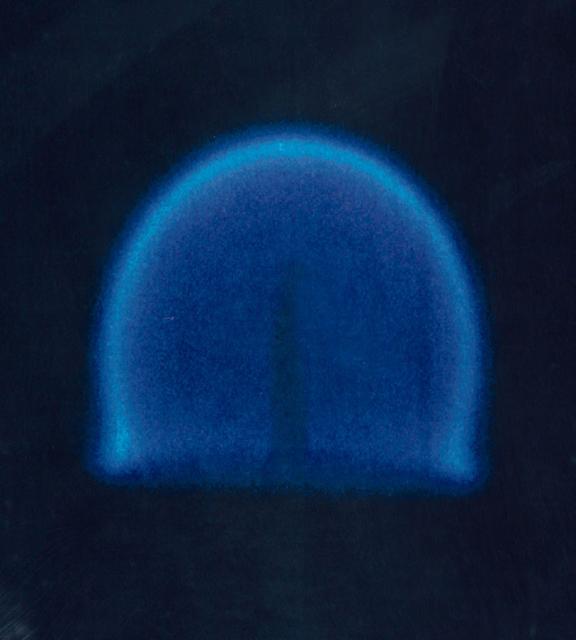 This photograph from CFM is a candle flame burning over time in microgravity, it shows that the candle flame continues to grow and exhibits less soot.