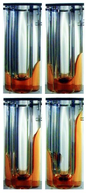 Interface Configuration Experiment on the Second United States Microgravity Laboratory (USML-2). Over time the photos show a change in the shape of the interface between a liquid and a gas in a sealed, slightly asymmetrical container. Under the force of Earth's gravity, the interface would remain nearly flat, but in microgravity, the interface shape and location changes significantly in the container, resulting in major shifts of liquid arising from small asymmetries in the container shape.