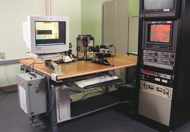 The Equiaxed Dendritic Solidification Experiment (EDSE) is a material sciences investigation under the Formation of Microstructures/pattern formation discipline. The objective is to study the microstructural evolution of and thermal interactions between several equiaxed crystals growing dendritically in a supercooled melt of a pure and transparent substance under diffusion controlled conditions. This image shows the overview for the EDSE in the Microgravity Development Lab (MDL).