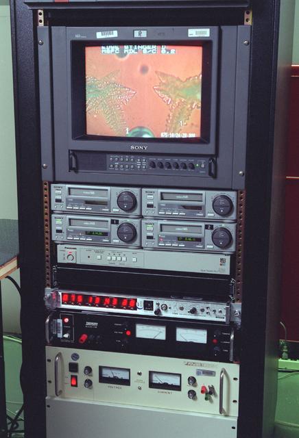 The Equiaxed Dendritic Solidification Experiment (EDSE) is a material sciences investigation under the Formation of Microstructures/pattern formation discipline. The objective is to study the microstructural evolution of and thermal interactions between several equiaxed crystals growing dendritically in a supercooled melt of a pure and transparent substance under diffusion controlled conditions. Video and power rack for the EDSE in the Microgravity Development Lab (MDL).