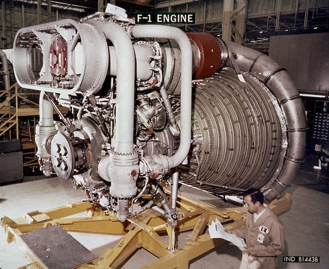 This close-up view of the F-1 engine for the Saturn V S-IC (first) stage shows the engine's complexity, and also its large size as it dwarfs the technician. Developed by Rocketdyne, under the direction of the Marshall Space Flight Center, the F-1 engine was utilized in a cluster of five engines to propel the Saturn V's first stage, the S-IC. Liquid oxygen and kerosene were used as its propellant. Initially rated at 1,500,000 pounds of thrust, the engine was later uprated to 1,522,000 pounds of thrust after the third Saturn V launch (Apollo 8, the first marned Saturn V mission) in December 1968. The cluster of five F-1 engines burned over 15 tons of propellant per second, during its two and one-half minutes of operation, to take the vehicle to a height of about 36 miles and to a speed of about 6,000 miles per hour. 
