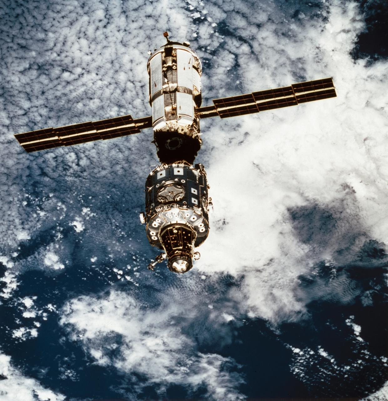 This STS-96 onboard photo of the International Space Station (ISS) was taken from Orbiter Discovery during a fly-around following separation of the two spacecraft. STS-96, the second Space Station assembly and resupply flight, launched on May 27, 1999 for an almost 10 day mission. The Shuttle's SPACEHAB double module carried internal and resupply cargo for station outfitting. Evident in the photo is the newly mounted Russian cargo crane, known as STRELA, which was carried aboard the shuttle in the integrated Cargo Carrir (ICC). The STS-96 flight was the first to perform docking with the ISS.